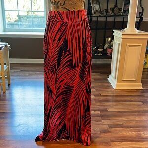 Orange and black tropical print maxi skirt with slits on both sides